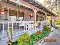 Front porch of LJ's Cozy Getaway - 1 bedroom cabin in Pigeon Forge, TN